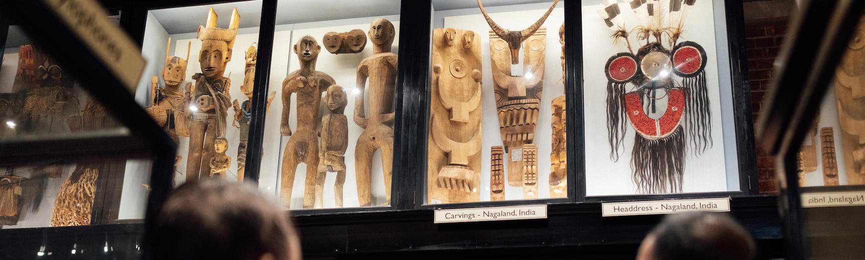 Naga delegates looking at Naga objects on display