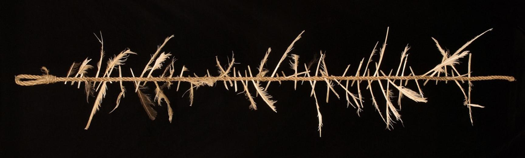 ‘Witch's ladder’ made of rope tied with feathers, England.
