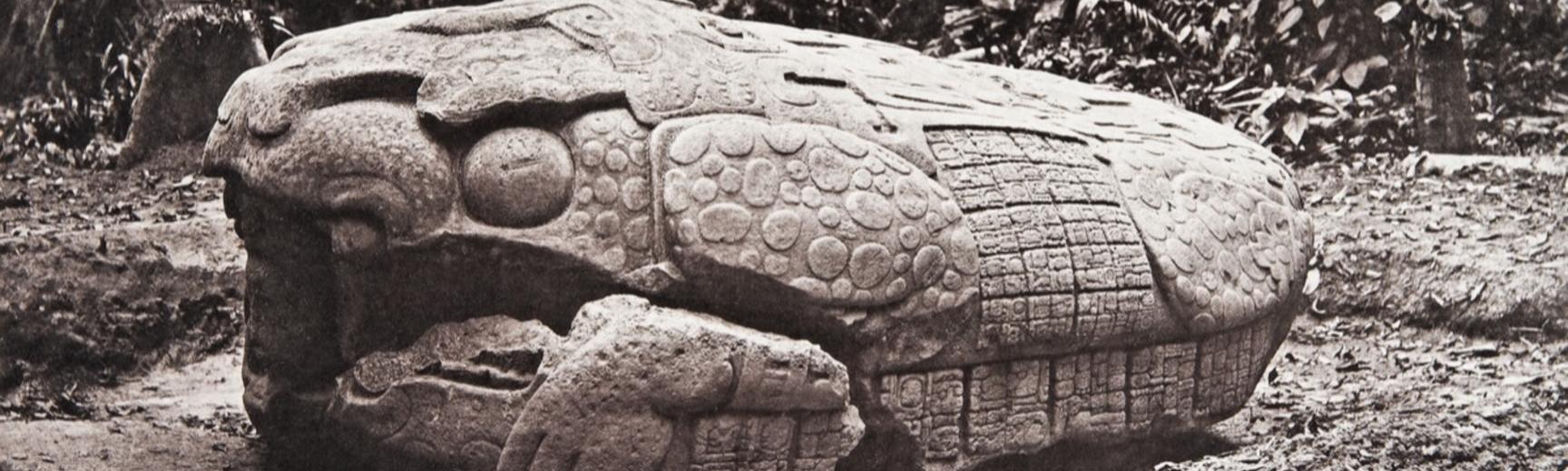Zoomorph G (also known as Monument 7), west side, dated AD 785. The monument is now understood by scholars to represent a ‘Waterlily Jaguar’, with human figures wearing headdresses emerging from both ends. It was created during the first year of the reign