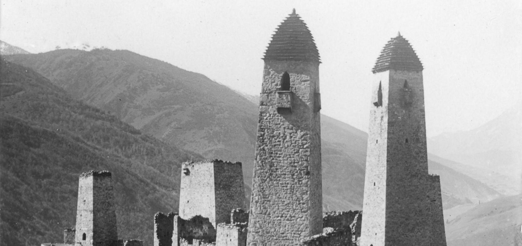 Look-out and refuge towers in Arzee. Similar towers were built all over the eastern Caucasus, though few remain today. Photograph by John Baddeley. Arzee, Russia. October 1901.