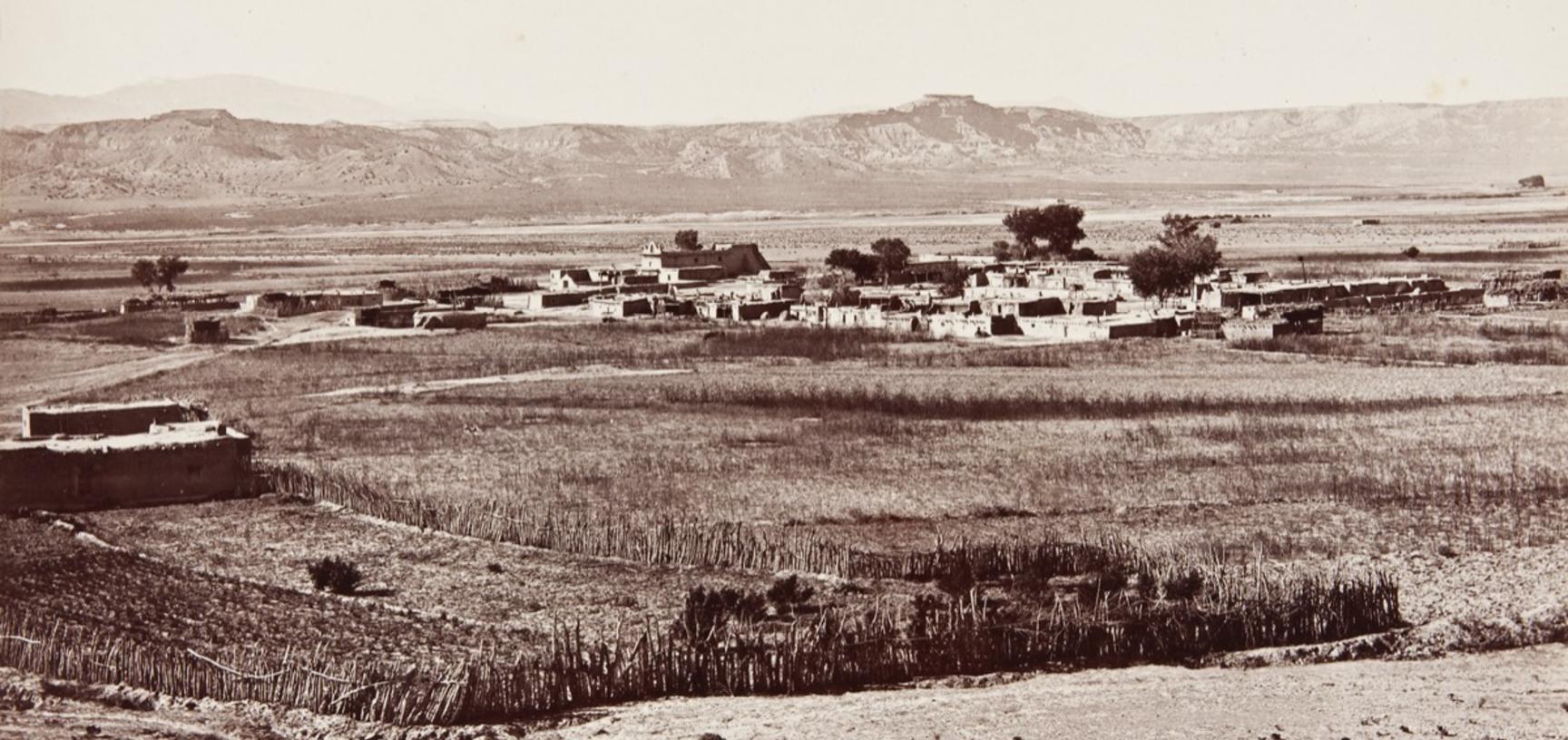 San Ildefonso Pueblo, possibly established as early as 1300, with its church (constructed under the direction of the Franciscans in 1717) clearly visible in the distance. 