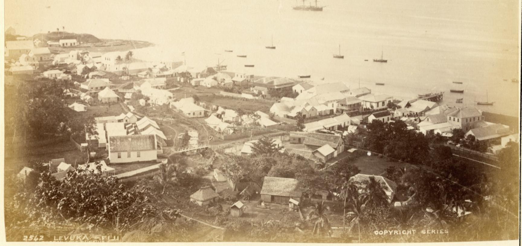 View of the former capital of Levuka on the Fijian island of Ovalau, ‘taken from the hills above the Hospital’. Photograph by Alfred Burton for the Burton Brothers studio (Dunedin). Levuka, Ovalau, Fiji. 14 July 1884.