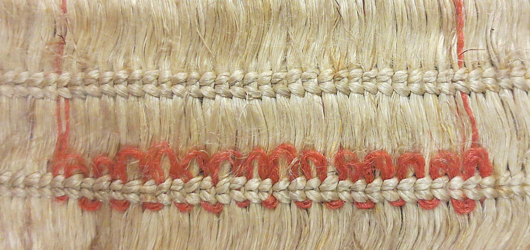 Detail of European wool decoration on cloak (1886.1.1132)