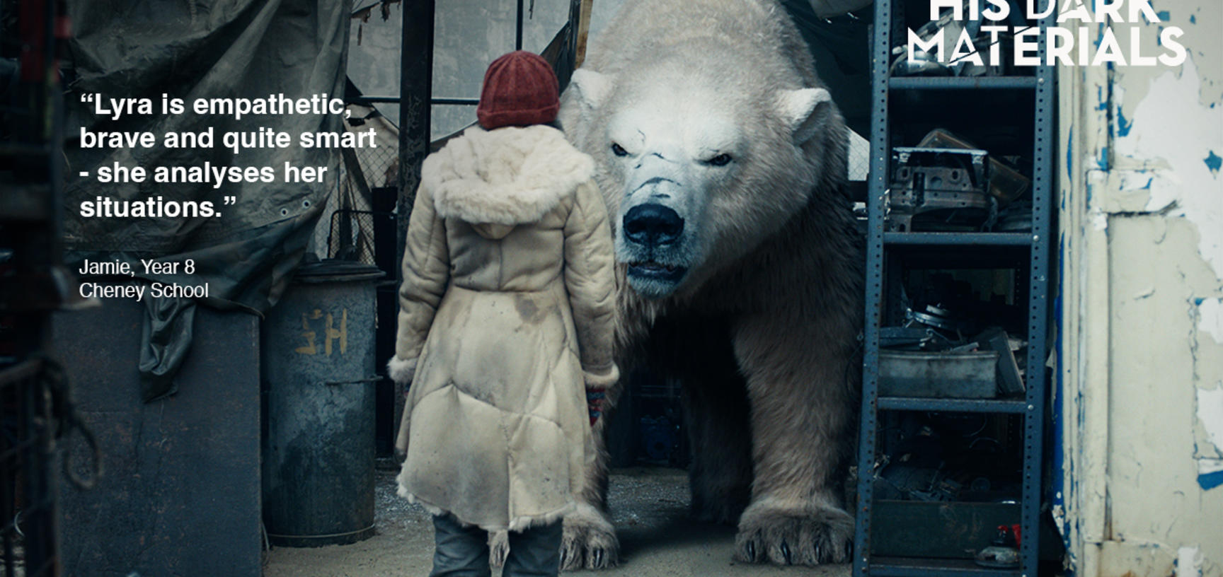 A girl stands infront of large white bear 
