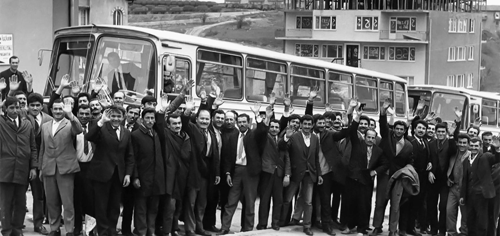 Group of Turkish immigrants waving