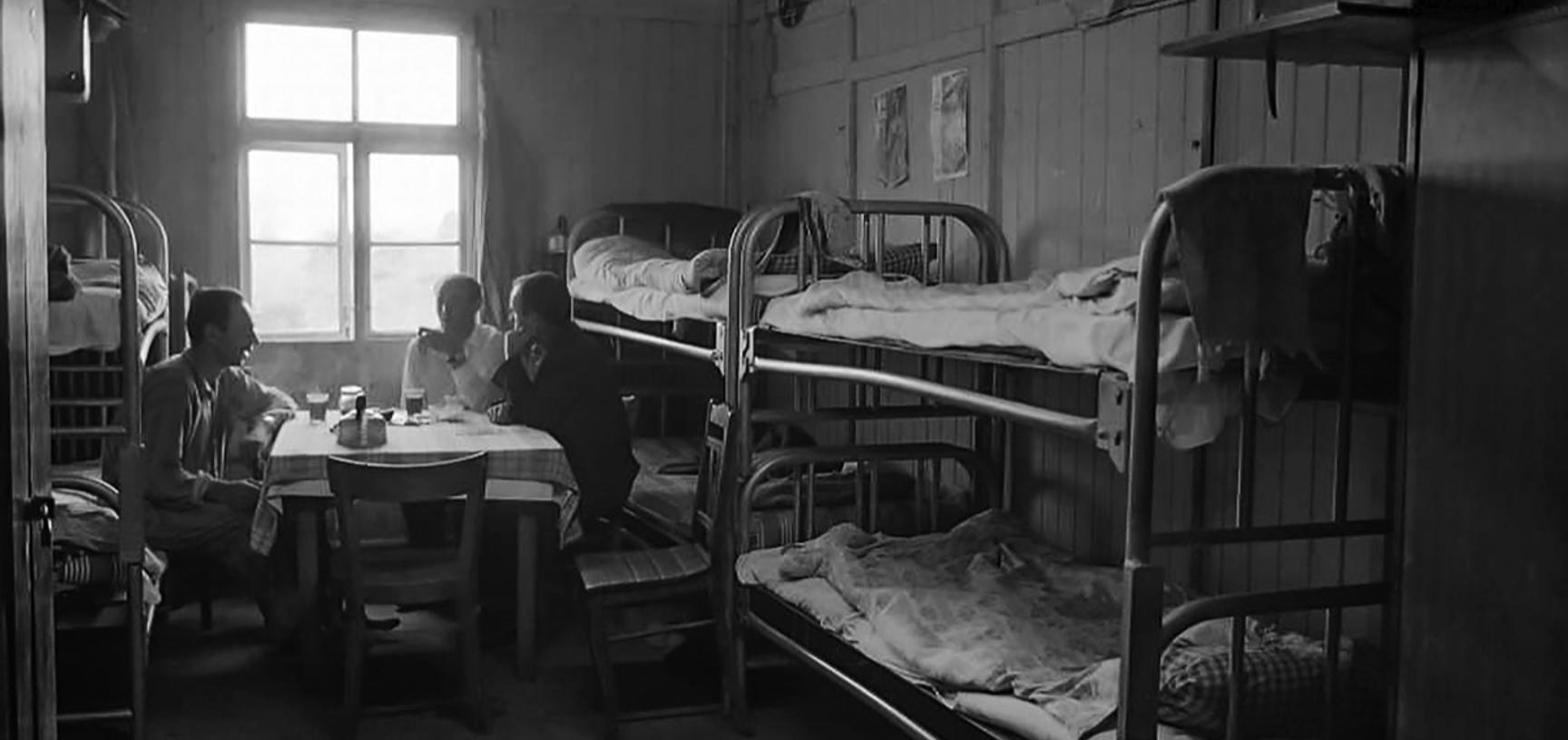 Immigrants chatting in a dormitory