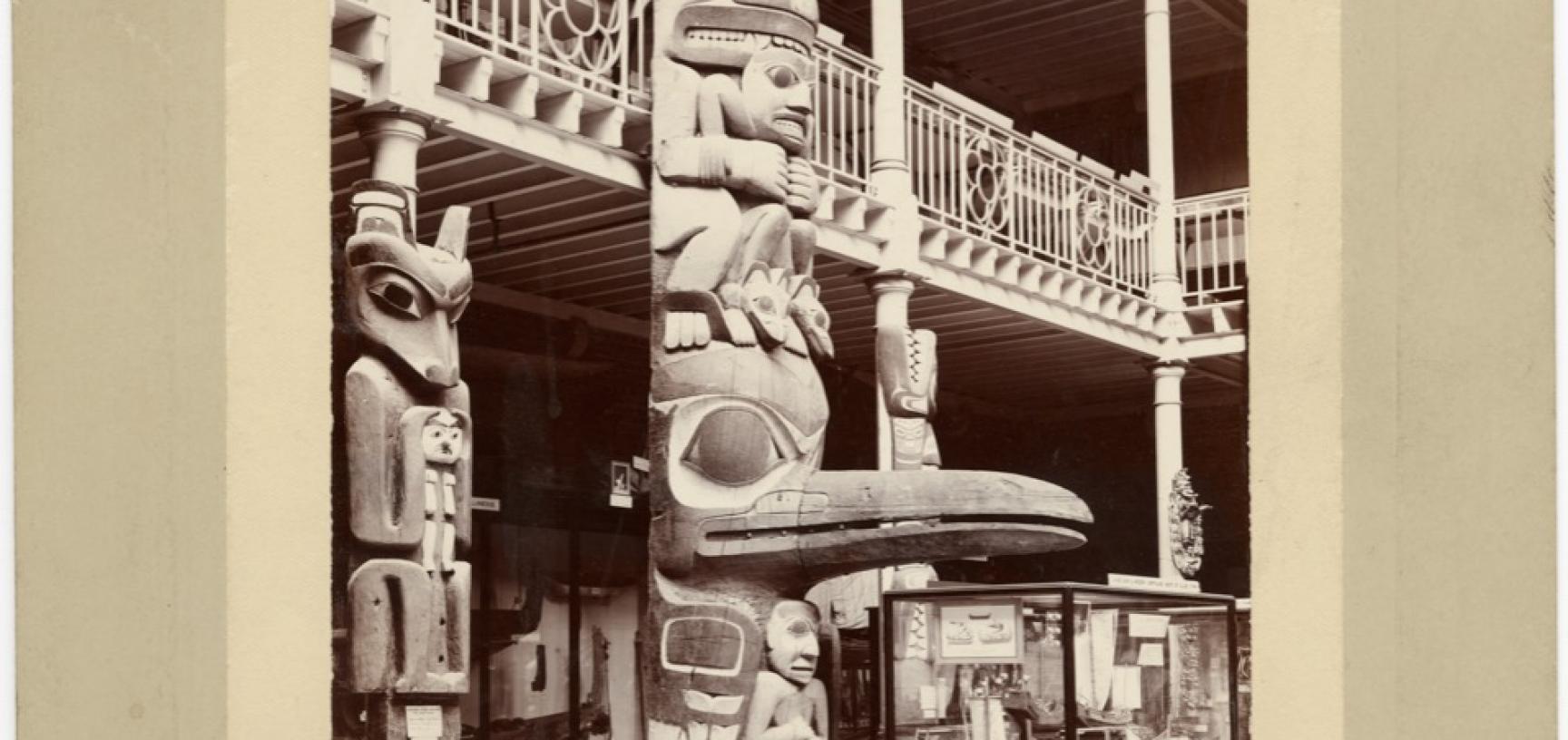 Interior view of the Pitt Rivers Museum, taken towards the east end of the Court, showing the lower part of the Haida totem pole (‘Star House Pole’). Photograph by Alfred Robinson. Oxford, England. 1901. (Copyright Pitt Rivers Museum, University of Oxford