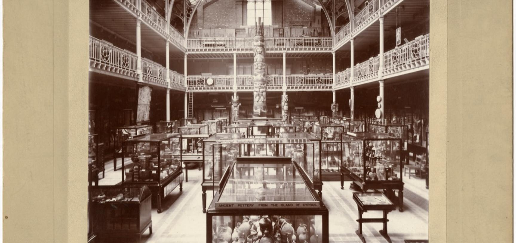 Interior view of the Pitt Rivers Museum, looking towards the east end of the Court, showing the Haida totem pole. Photograph by Alfred Robinson. Oxford, England. Circa 1901. (Copyright Pitt Rivers Museum, University of Oxford. Accession Number: 1998.267.2