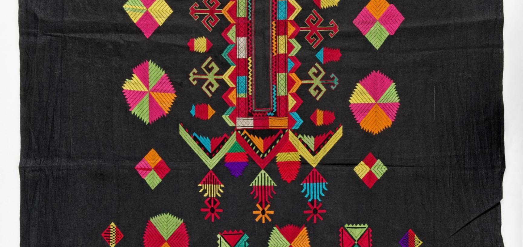 Embroidered cotton shift (incomplete). Bar Paro, Palas Valley, Kohistan, Pakistan. Instead of traditional silk, solar motifs and the protective power of the triangle are embroidered in cotton yarn.