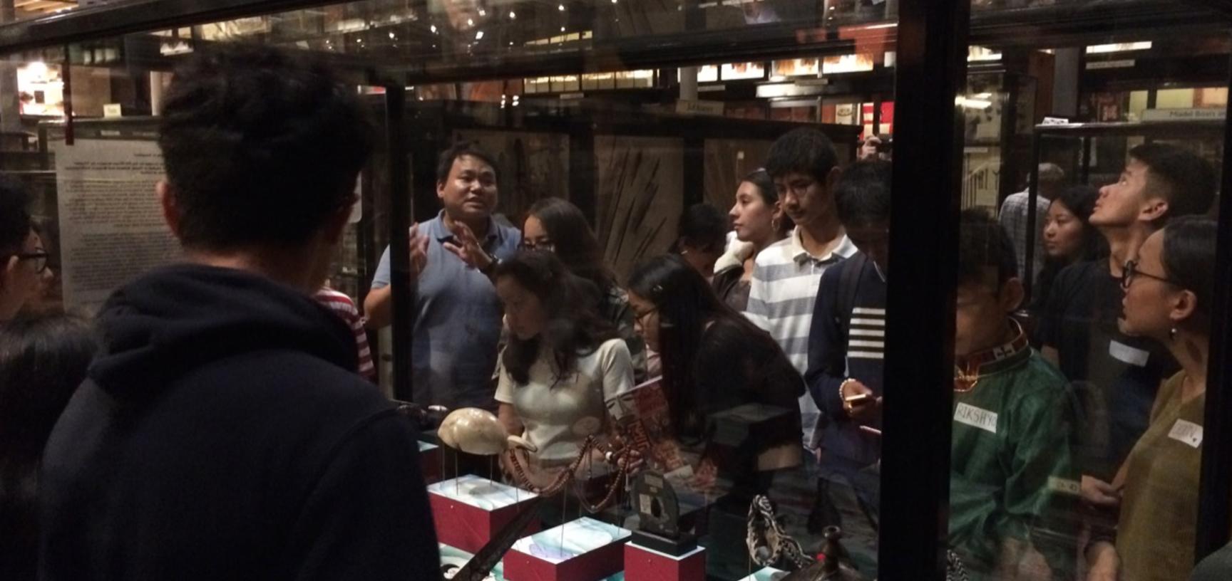Thupten Kelsang discussing the display with teenage members of the UK’s Tibetan community during a public engagement event, ‘My Tibet Museum’, held at the Pitt Rivers Museum in October 2018.