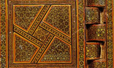 Detail of Qur’an stand with inlays of wood and gold patterns
