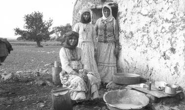 Three Palestinian women working at archaeology excavation