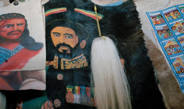 Items for sale in an Addis Ababa shop, including one featuring the image of Haile Selassie with his military decorations. Addis Ababa, Ethiopia. Photograph by Peter Marlow. 2000.