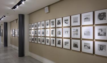 Display of black and white photographs on a wall