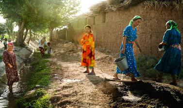 The intermittent flow of an irrigation canal is the only source of water in a village in south-western Tajikistan built for cotton farming under the Soviet Union. Yulduzqoq, Tajikistan. Photograph by Carolyn Drake. July 2008.