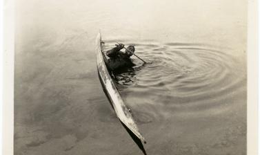 Photograph depicting one of the stages of a ‘kayak roll’, an exercise to enable kayakers to learn how to right themselves quickly if capsized in freezing waters. Photographer unknown. Greenland. 1930–1931.