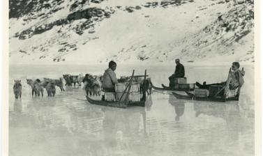 Rebecca (Inuk), Percy Lemon and Alfred Stephenson seated on sledges at Base Fjord. Photograph by Henry Iliffe Cozens. Base Fjord, Greenland. 1930–1931.