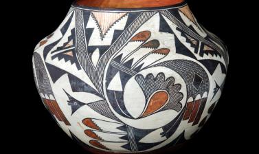 Pottery water jar with black, white and orange pattern designs
