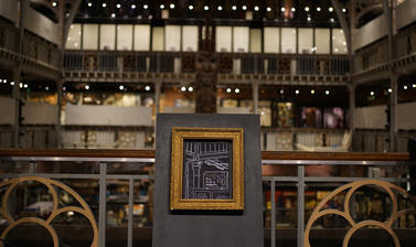 White pencil line drawing on black paper depicting a detail of the Museum architecture and Pitt Rivers Museum sign