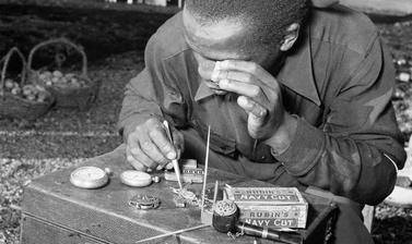 Watch repairs. Windermere, Cape Town, South Africa. Photograph by Bryan Heseltine. Circa 1949–1952. (Copyright Bryan Heseltine)