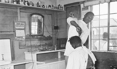 Barber shop. Langa, Cape Town, South Africa. Photograph by Bryan Heseltine. Circa 1949–1952. (Copyright Bryan Heseltine)