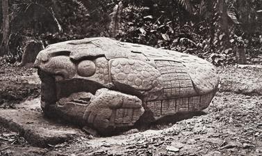 Zoomorph G (also known as Monument 7), west side, dated AD 785. The monument is now understood by scholars to represent a ‘Waterlily Jaguar’, with human figures wearing headdresses emerging from both ends. It was created during the first year of the reign