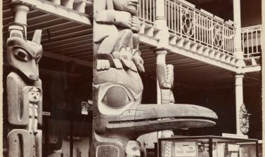 Interior view of the Pitt Rivers Museum, taken towards the east end of the Court, showing the lower part of the Haida totem pole (‘Star House Pole’). Photograph by Alfred Robinson. Oxford, England. 1901. (Copyright Pitt Rivers Museum, University of Oxford