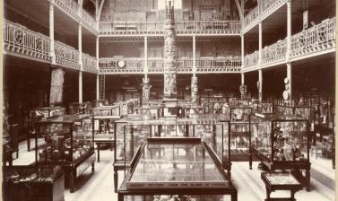Interior view of the Pitt Rivers Museum, looking towards the east end of the Court, showing the Haida totem pole. 