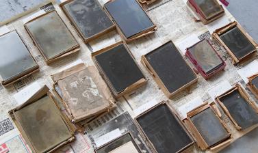 Fragile glass negatives, still in their original boxes, are laid out to dry. (Copyright RD3 Project/Rikuzentakata City Museum)