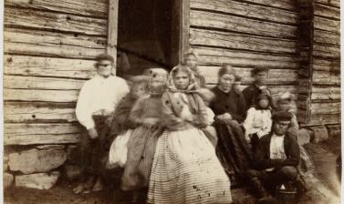 Portrait of a Finnish family. In his diary Evans described photographing such a group: ‘At Rungam, where we once more crossed the river Kemi, I tried taking a photograph of a large group of Finns, & actually succeeded in getting them to sit, but when the 