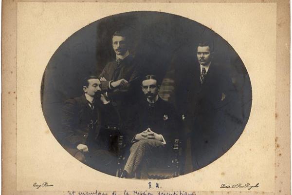 oval framed black and white group portrait photo of four men