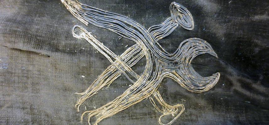 Repairing the kimono oni figure (1964.1.2.5)