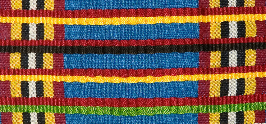 Brightly coloured chequered woven textile, using red, yellow, black, white and green stripes.  These cloths are woven in narrow strips which are then stitched together.