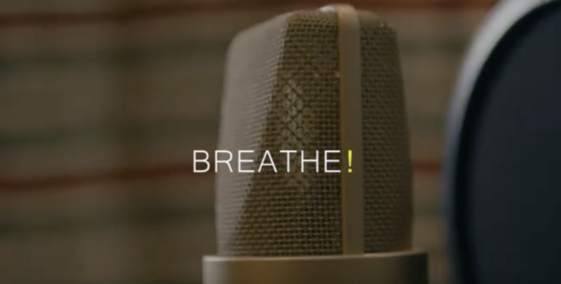 close up view of a microphone with the title 'BREATHE!' overlaid