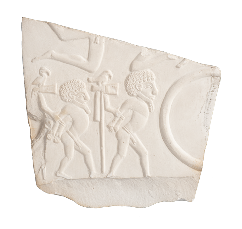 An angular fragment of white plaster showing a relief of two men with arms restrained behind their backs, facing the right as if walking. 