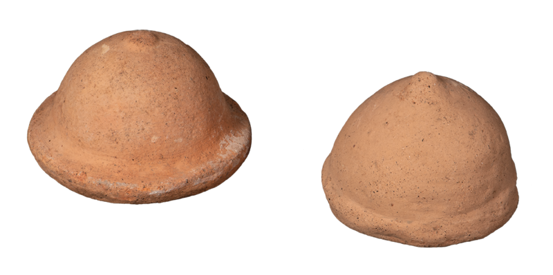 two small clay domes representing breasts