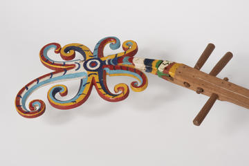 Close up of the colourfully painted neck of a lute