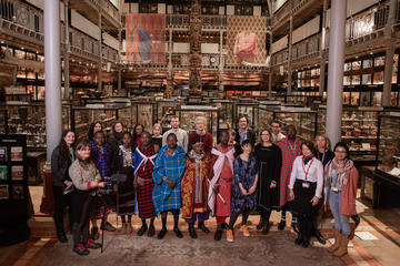 Staff and Maasai visitors in Pitt Rivers Museum