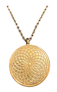 Gold circular locket incised with overlapping circles creating a flower pattern, hung on a chain.